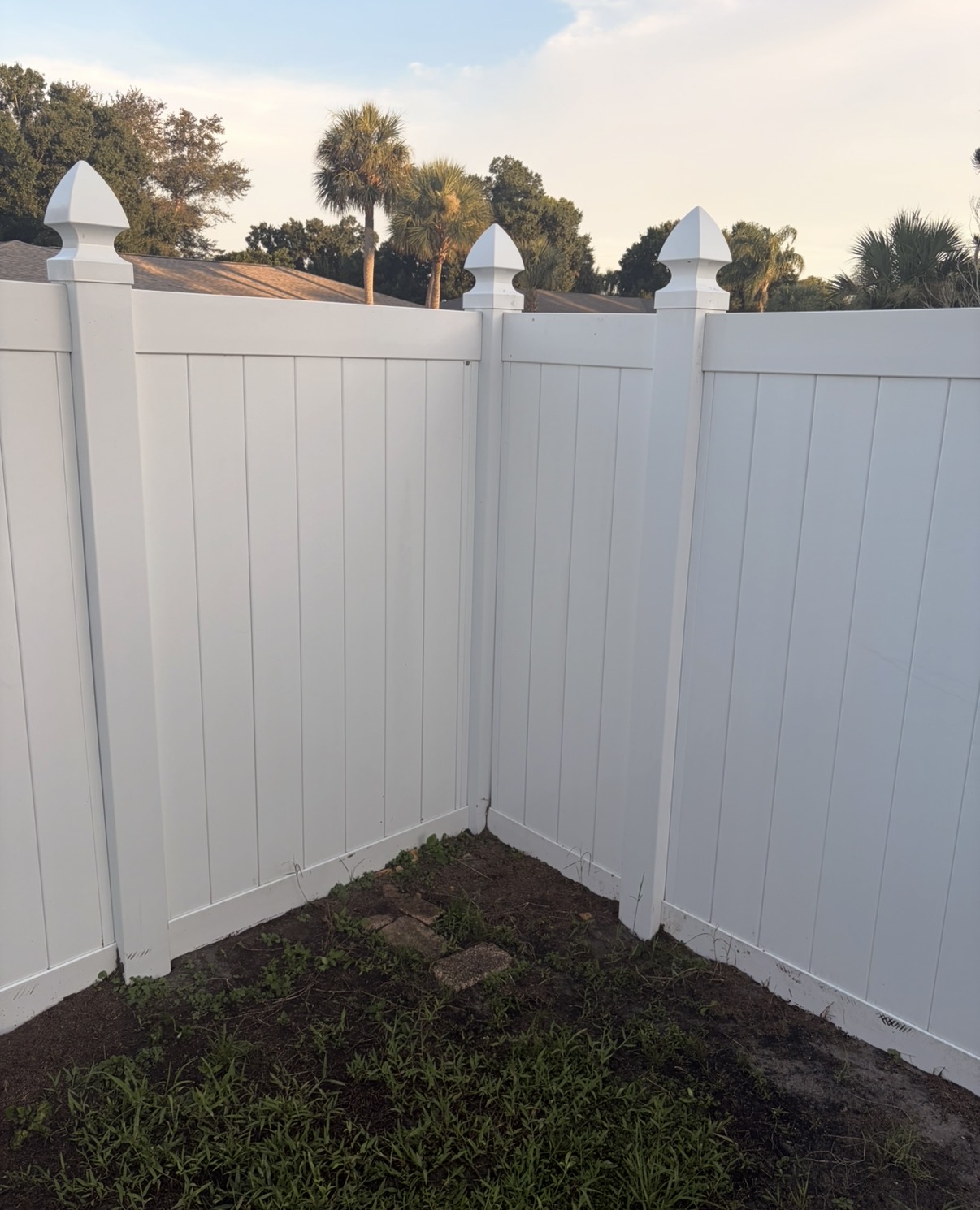 Same vinyl privacy fence, bright white after soft washing