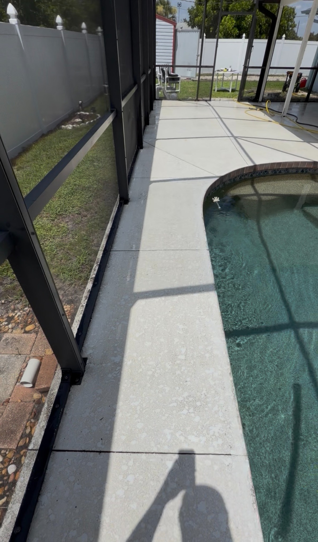 Fully cleaned pool deck and lanai walkway